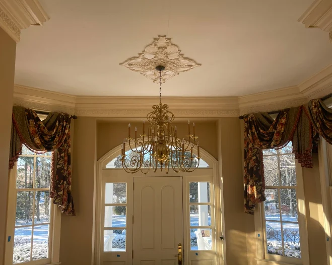 new chandelier installed in a entryway